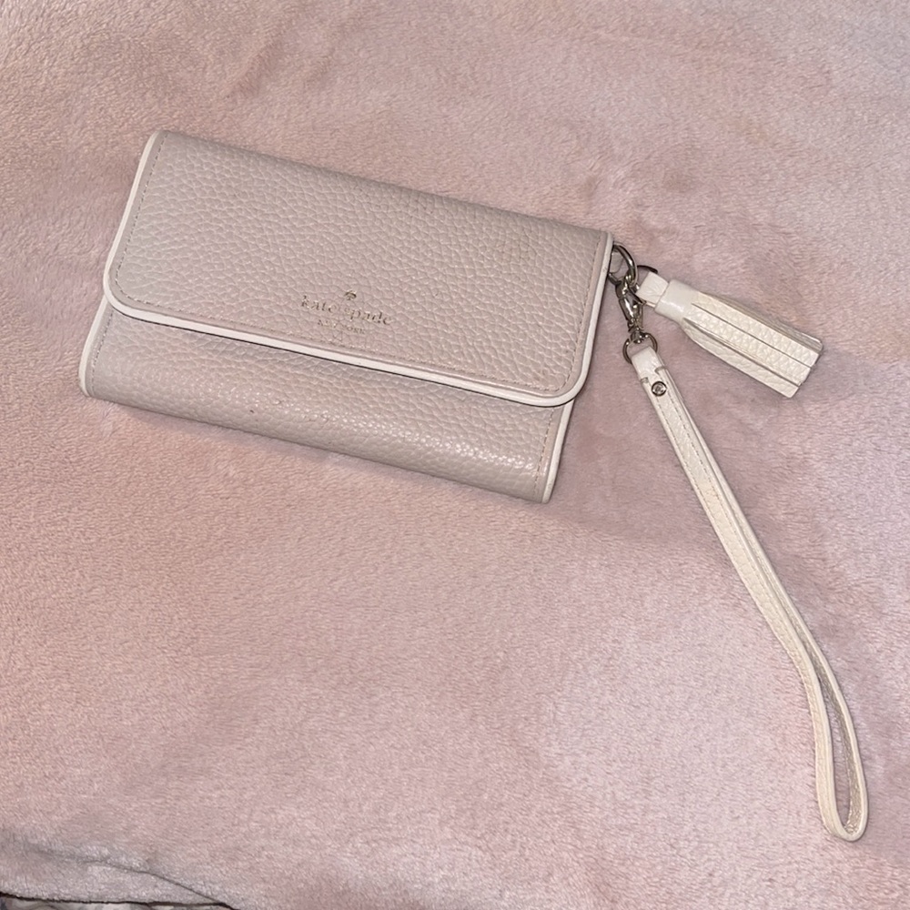 Kate Spade Tri-Fold Wristlet with phone holder in color nude pink